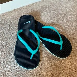 Like new! Worn once, Nike flip flops!